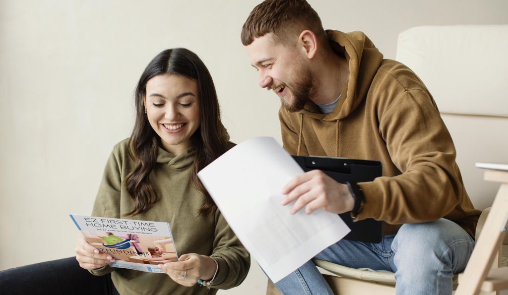 A couple reading EZ Fundings Home Loans First-time Home Buyers Guide.